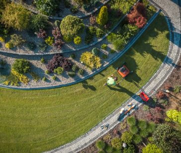 aerial-view-of-landscaper-aerating-clients-lawn-2025-03-15-07-08-51-utc (1)